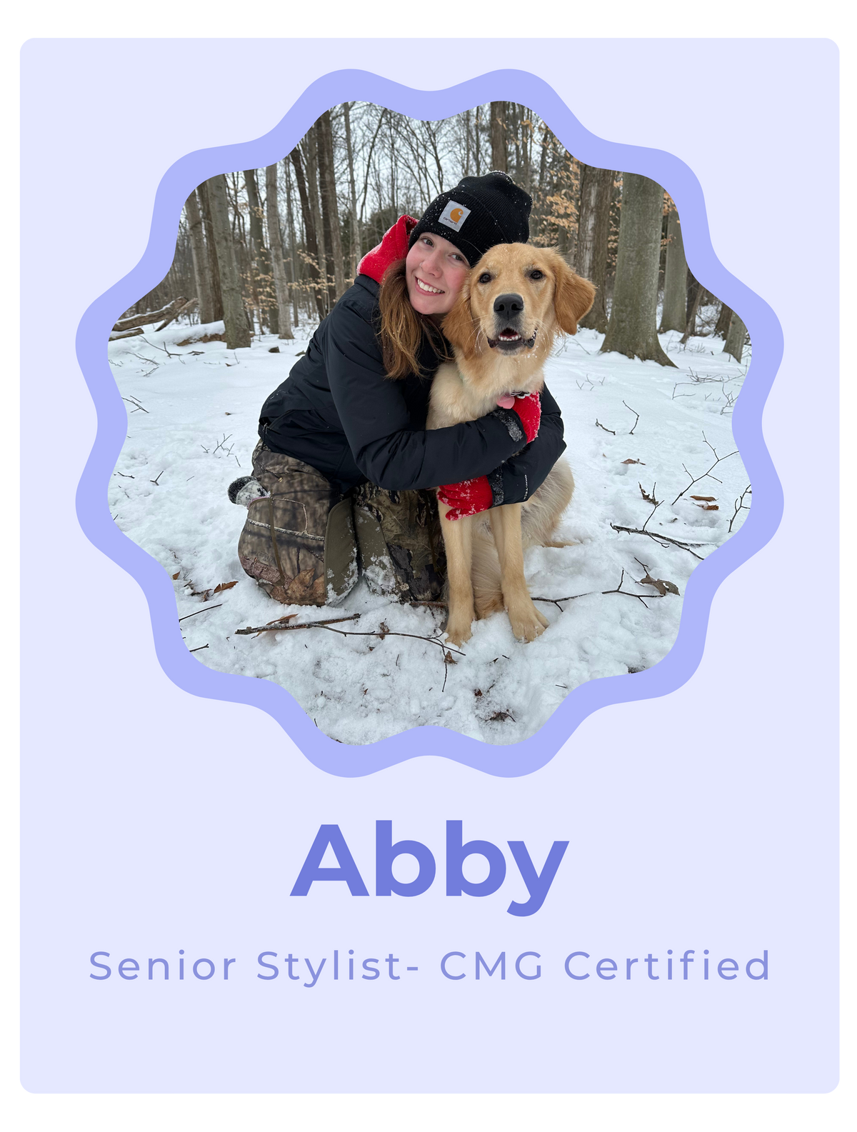 A personalized photo card featuring a lavender border and background. The central photo shows a woman in a black jacket and camouflage pants hugging a golden retriever dog in a snowy forest.